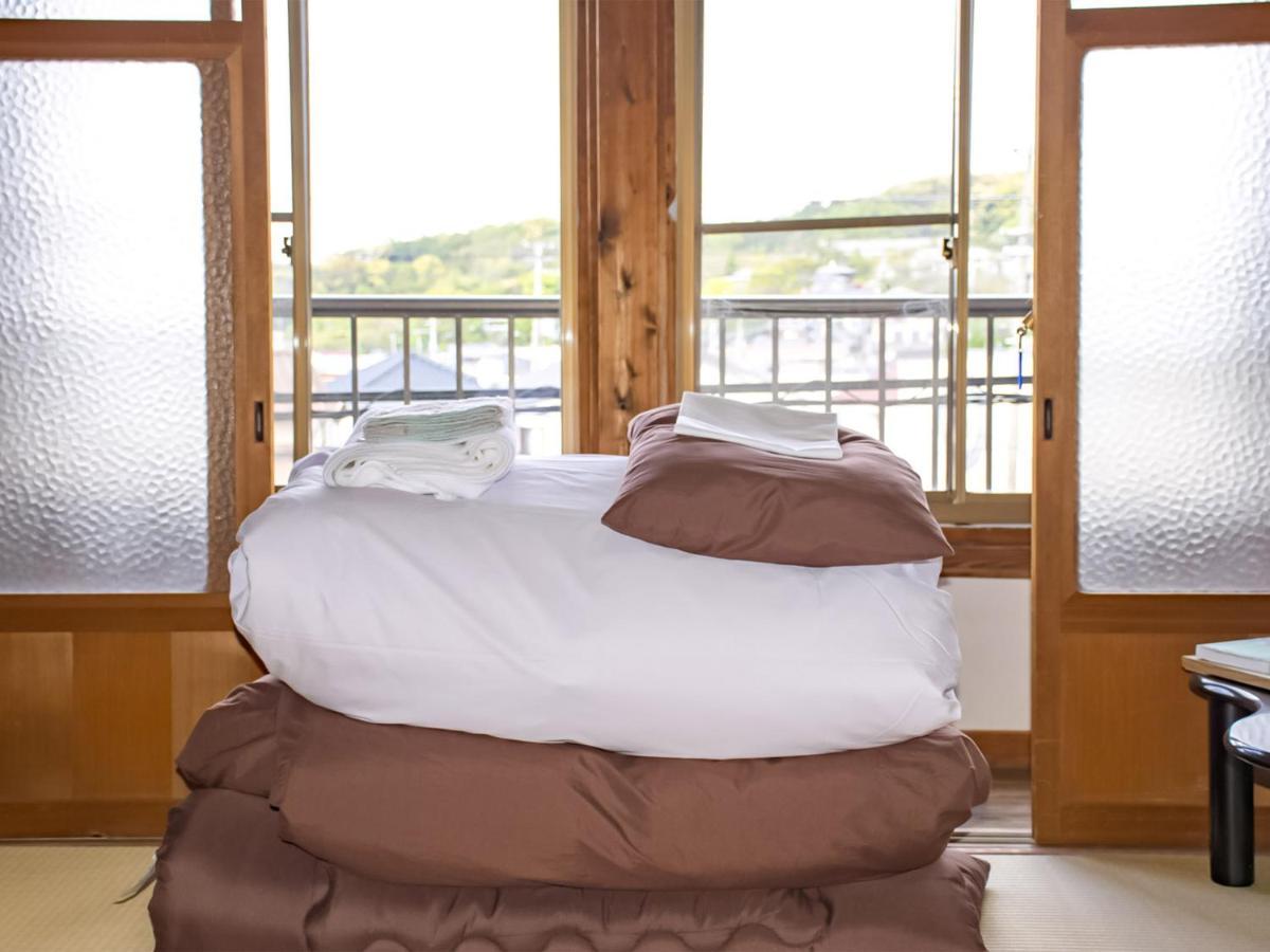 Guest Cafe Kuchikumano Hotel Kamitondacho Екстериор снимка